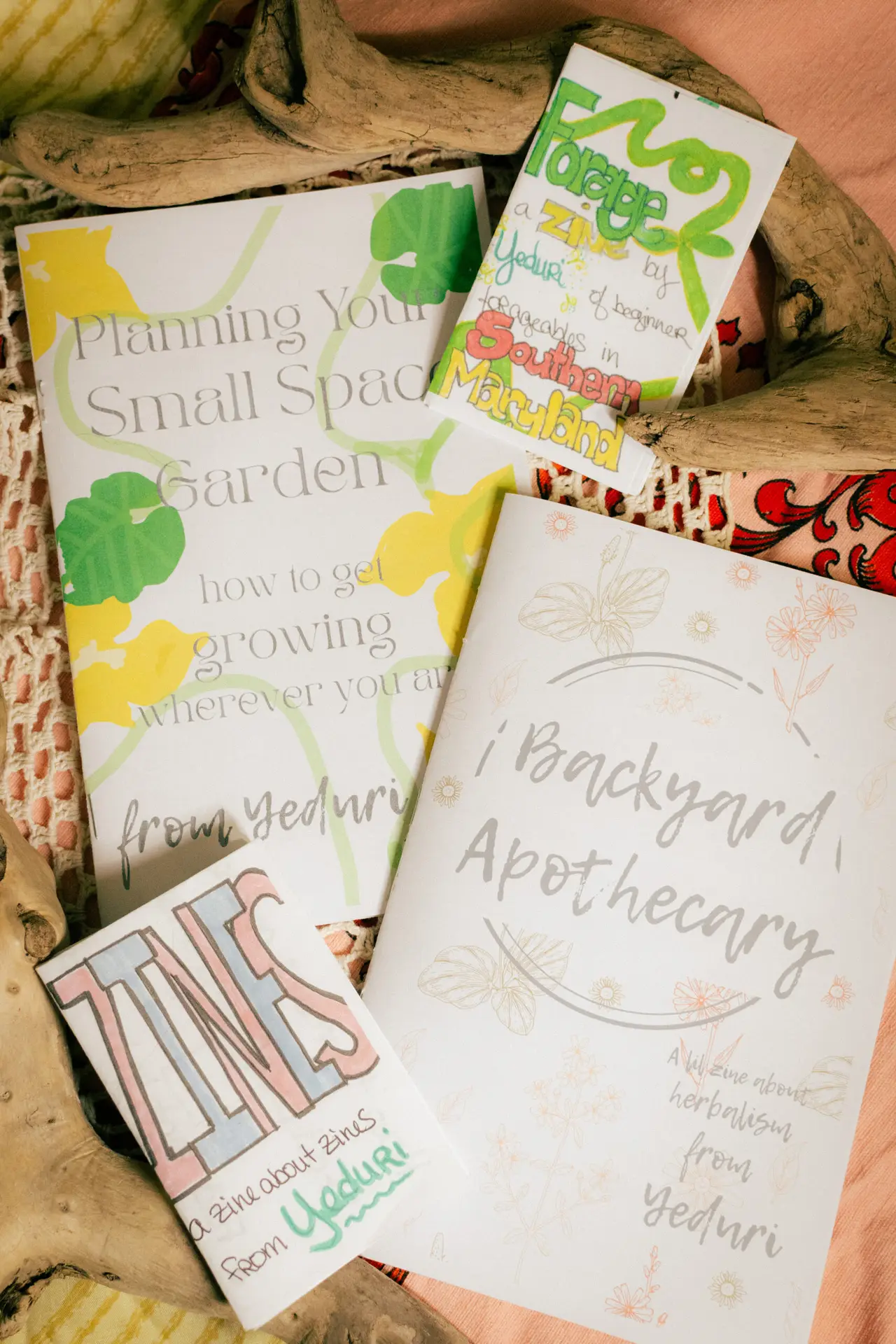 Yeduri Zines - mini magazines posed on a fabric background